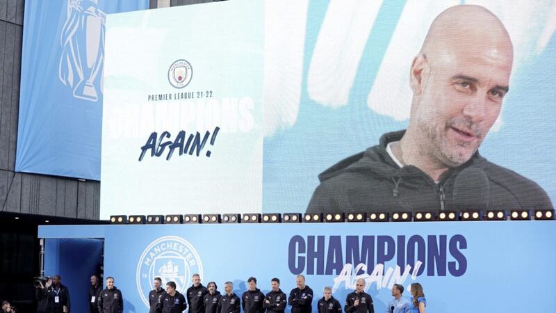 Manchester City manager Pep Guardiola on stage during the Premier League trophy parade in Manchester. 