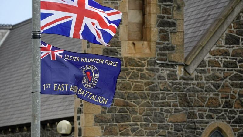 A UVF flag and Union flag on a lamp post last year outside St MacNissi&#39;s Catholic church in Larne, Co Antrim 