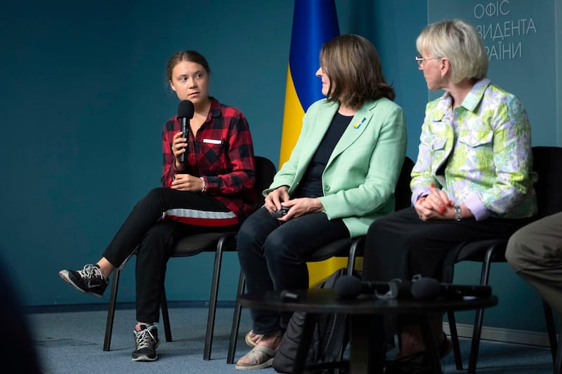 Greta Thunberg and members of the working group