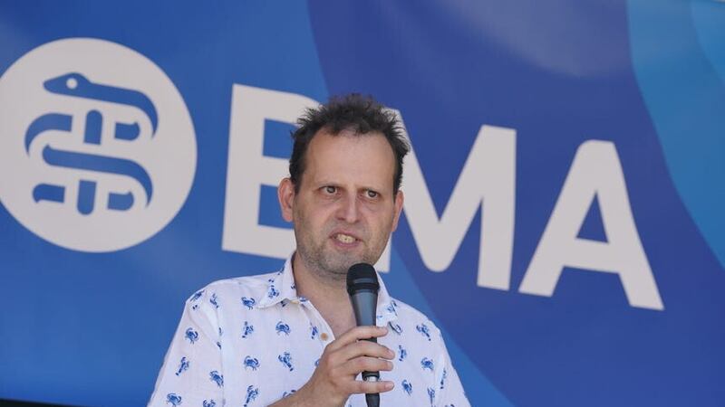 TV writer, author, and former doctor Adam Kay, speaks as striking junior doctors from the British Medical Association take part in a rally in Parliament Square (Lucy North/PA)