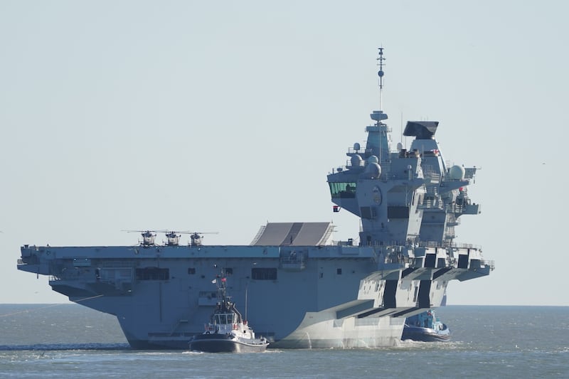 Royal Navy aircraft carrier HMS Prince of Wales setting sail from Portsmouth