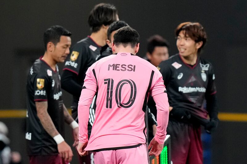 Lionel Messi again started on the bench as he manages a hamstring problem (Eugene Hoshiko/AP)