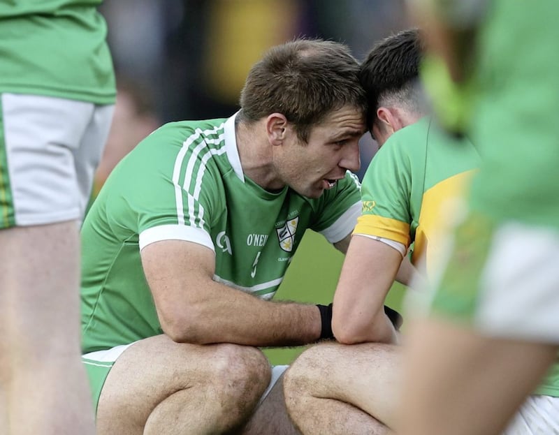 Tony Scullion has a few words of comfort for Creggan&#39;s Conor Small after last Sunday&#39;s county final Picture: John McIlwaine 