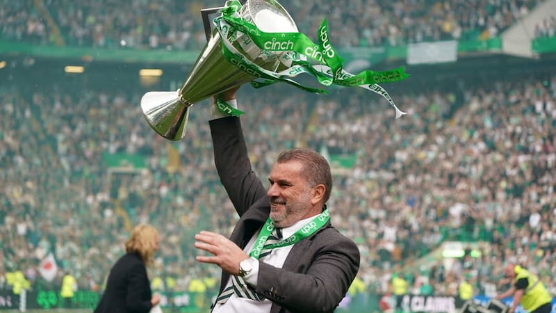 Ange Postecoglou celebrates with the league trophy (Andrew Milligan/PA)