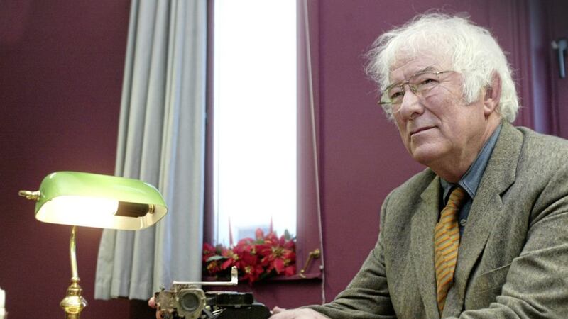Seamus Heaney sitting at Michael McLaverty&#39;s typewriter at Belfast&#39;s Linenhall Library in 2005. File picture by Colm Lenaghan 