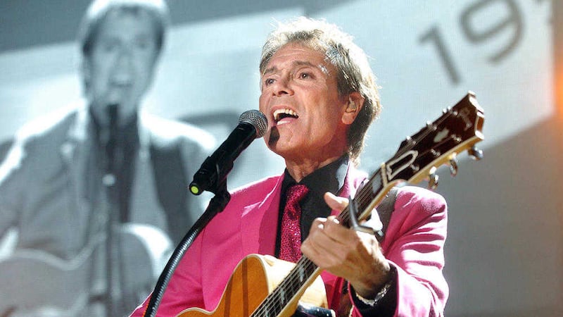 Cliff Richard playing to a full house in the Odyssey Arena, Belfast. The veteran pop star says untrue, but widely publicised sex allegations against him almost brought him to death&#39;s door 