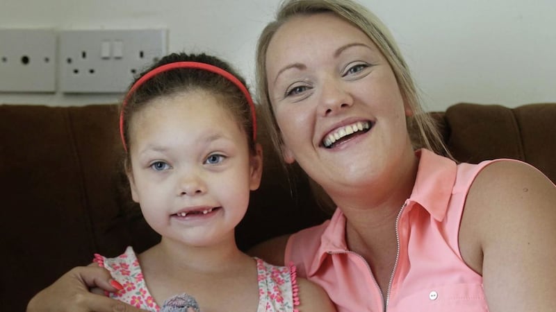 Sophia Gibson at home in Newtownards with her mum Danielle. The seven-year-old has a long-term licence for cannabis oil to manage her epilepsy. Picture by Hugh Russell 
