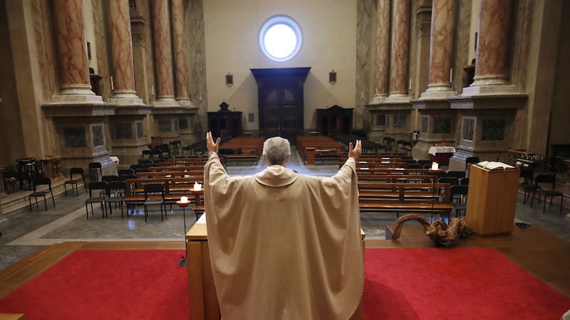 The experience of Fr Angelo Riva, pictured here on Thursday April 2 as he celebrates Mass in an empty church in Carenno, Italy, shows how priests often fund themselves at the heart of the circle of contagion.&nbsp;Within two weeks of sitting with his parents and a fellow priest&nbsp;at lunch, Fr Riva&nbsp;was grieving the deaths of both his father and the colleague who assisted him at three mountain parishes above Lake Como and&nbsp;preparing for his mother to die, too. Picture by&nbsp;AP Photo/Antonio Calanni, File