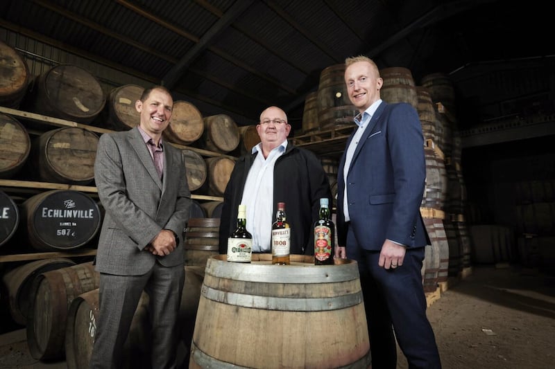 The Echlinville Distillery&#39;s owner, Shane Braniff (centre), pictured with Gavin North (left) and Niall Devlin (right) from Bank of Ireland UK. Picture by Kelvin Boyes 