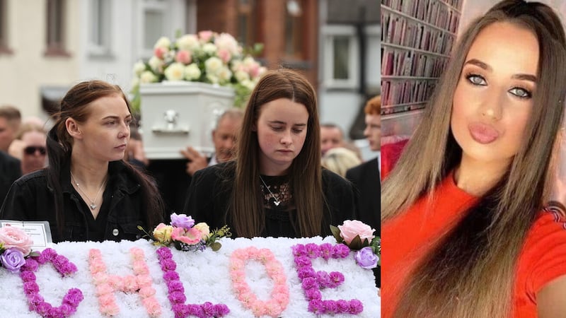 Chloe Mitchell (right) and sisters Kirsty and Nadine (left) in front of her coffin as it is carried through Ballymena on June 29. Picture by Liam McBurney/PA