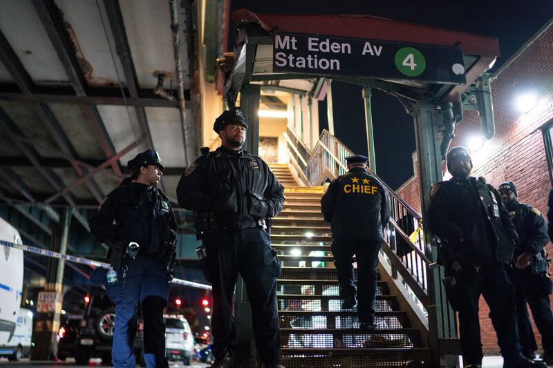 New York City Police officers stand guard following a shooting at the Mount Eden subway station in the Bronx Eduardo Munoz Alvarez/AP)