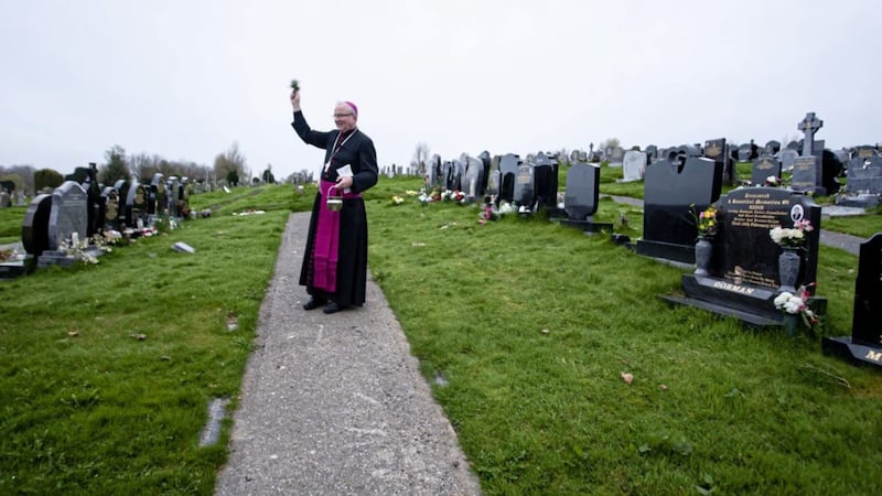 Bishop of Derry Donal McKeown blessing graves at the Derry City Cemetery in a poignant dawn ceremony on Easter Sunday. The cemetery was closed because of Covid-19 restrictions. As churches look forward to reopening, the bishop has said they must show themselves to be &#39;the safest places in town&#39;. Picture by Jim McCafferty Photography 