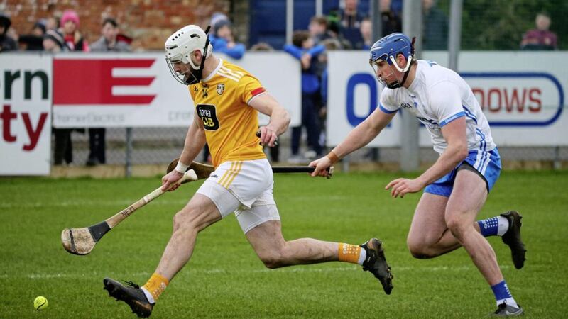 Antrim&#39;s Neil McManus and Waterford&#39;s Austin Gleeson, the two top scorers in the NHL Division 1B meeting at Corrigan Park, chase for the sliotar. Picture Mal McCann 