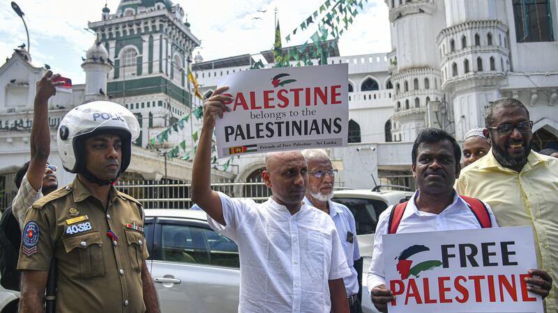 Sri Lankans participate in a protest against Israeli air strikes on Gaza and to show solidarity with Palestinian people (AP)