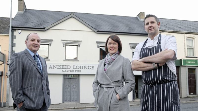 Ulster Bank business development manager Derick Wilson (left) with husband and wife team Nick and Joanne Clough 
