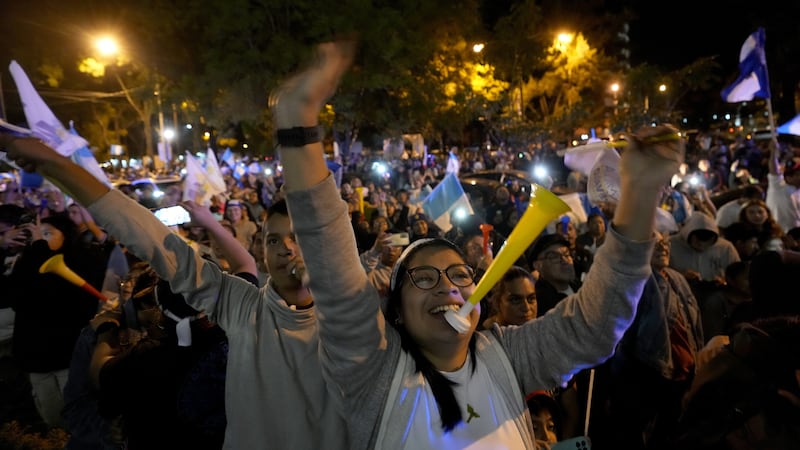 Supporters of Bernardo Arevalo celebrate after preliminary results showed him the victor in a presidential run-off election (AP)