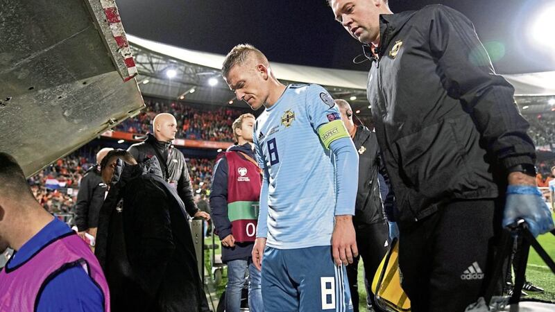 Northern Ireland captain Steven Davis leaves the pitch after his side&#39;s defeat to Holland 