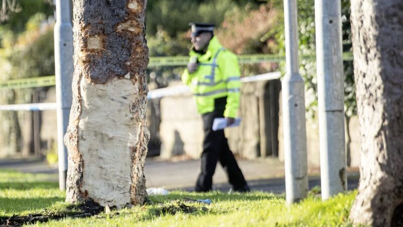 Police at the scene where a stolen car crashed into a tree (left) in Stonegate Road, Leeds. West Yorkshire Police said five people were killed, including three children PICTURE: Danny Lawson/PA 