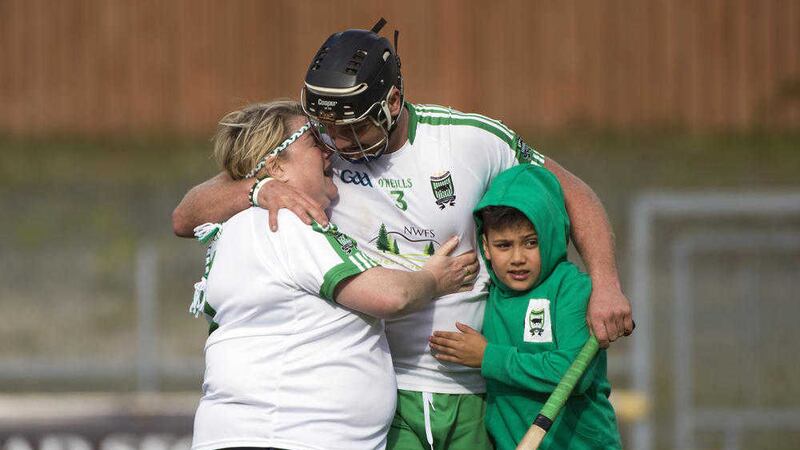 Jamesie Donnelly gets a hug from his mum Helen and nephew Daniel after winning the Donegal senior hurling championship.&nbsp;