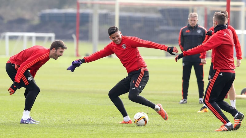 Manchester United's Michael Carrick and Marcos Rojo during a training session in Manchester on Wednesday<br />Picture by PA&nbsp;