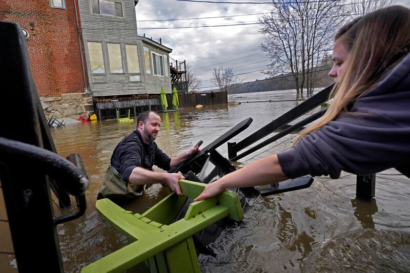 Residents in Hallowell, Maine as waters continued to rise in the Kennebec River (Robert F Bukaty/AP)