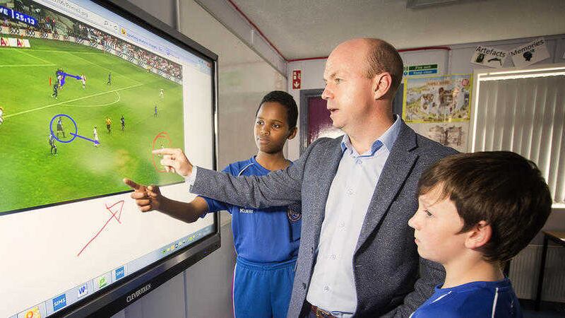 Tyrone legend Peter Canavan illustrates to pupils the value of touchscreen technology