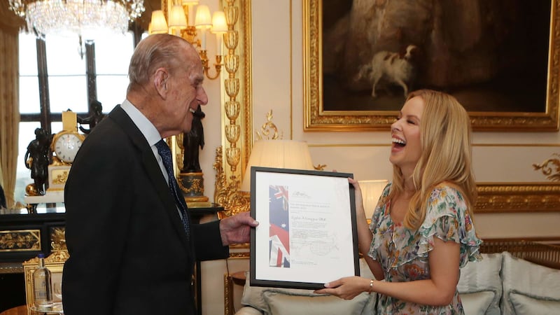 He presented her with an award at Windsor Castle.