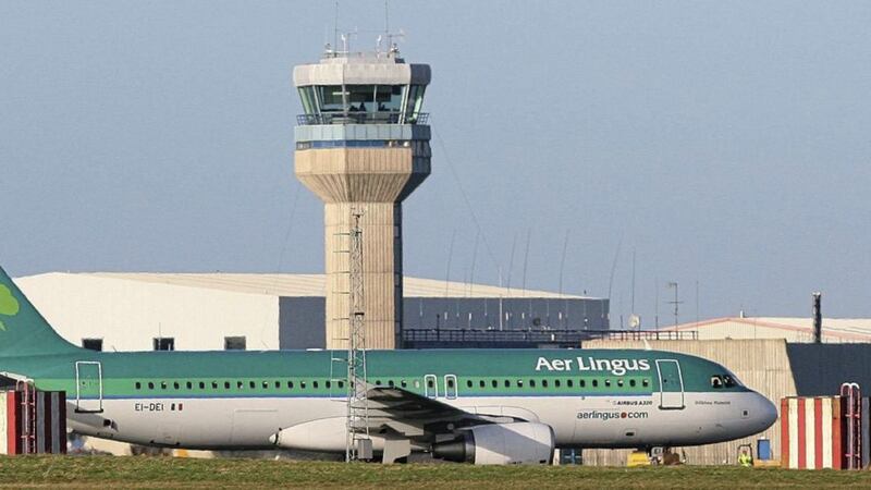 An Aer Lingus jet passing a traffic control tower at Dublin airport. File picture by Niall Carson, Press Association