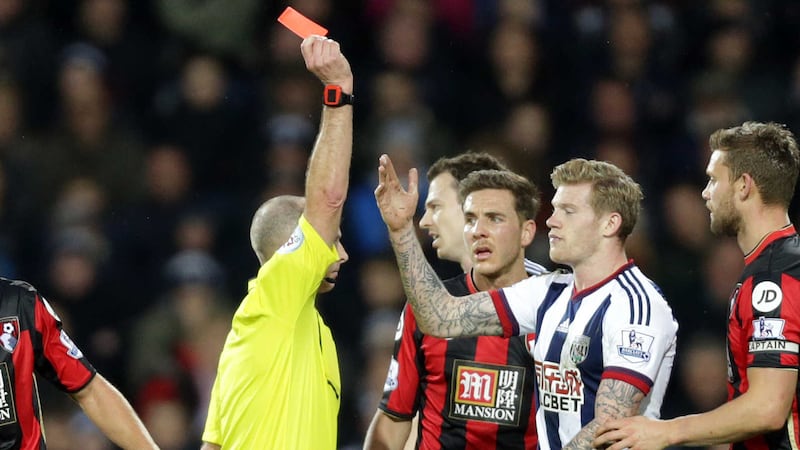 West Brom's James McClean is shown a red card by referee Mike Dean during Saturday's match against Bournemouth at the Hawthorns <br />Picture by PA&nbsp;