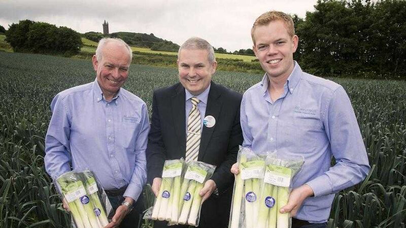 Roy Lyttle pictured with Tony O&rsquo;Neill, manager of the Tesco Newtownards store and son, Alexander Lyttle at their farm in the Ards peninsula 