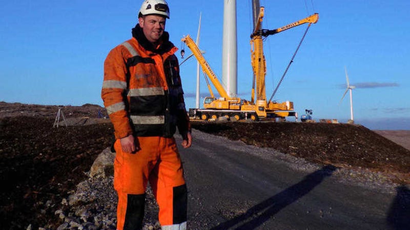 An engineer at a wind turbine construction site 