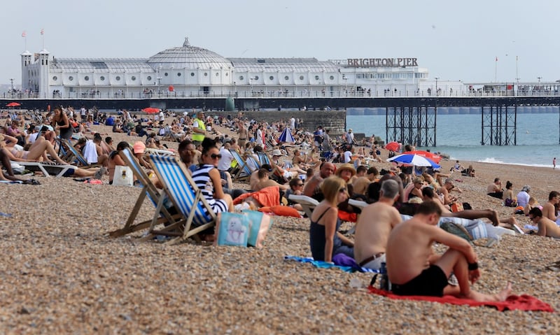 people on the beach in brighton (Gareth Fuller/PA)