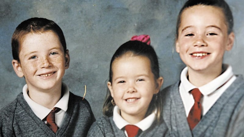 A primary school photograph of Michael McIlveen with his little sister Francine and older sister Jodie 