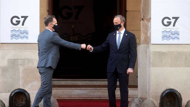 British foreign secretary Dominic Raab (right) fist bumps German Federal Minister for Foreign Affairs, Heiko Maas (left), arriving at Lancaster House, London, during this morning's G7 foreign and development ministers meeting. Picture by Hannah McKay/PA Wire&nbsp;