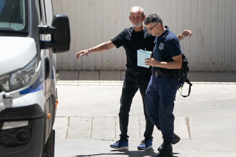 David Hunter is transported from Paphos District Court in Cyprus after he was found guilty of the manslaughter of his terminally ill wife Janice