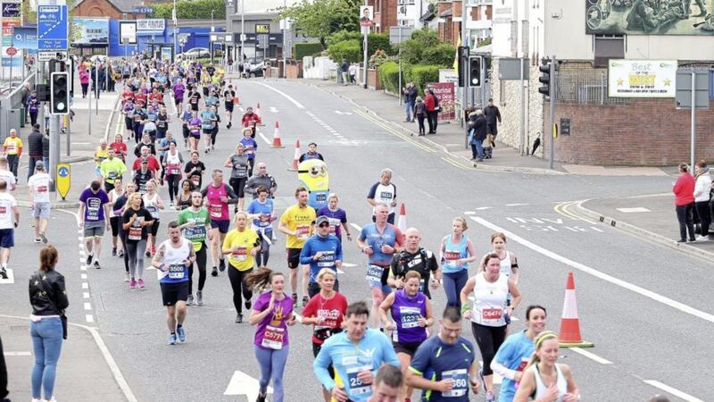 Marathon runners make their way down the Andersonstown Road Picture by Mal McCann. 