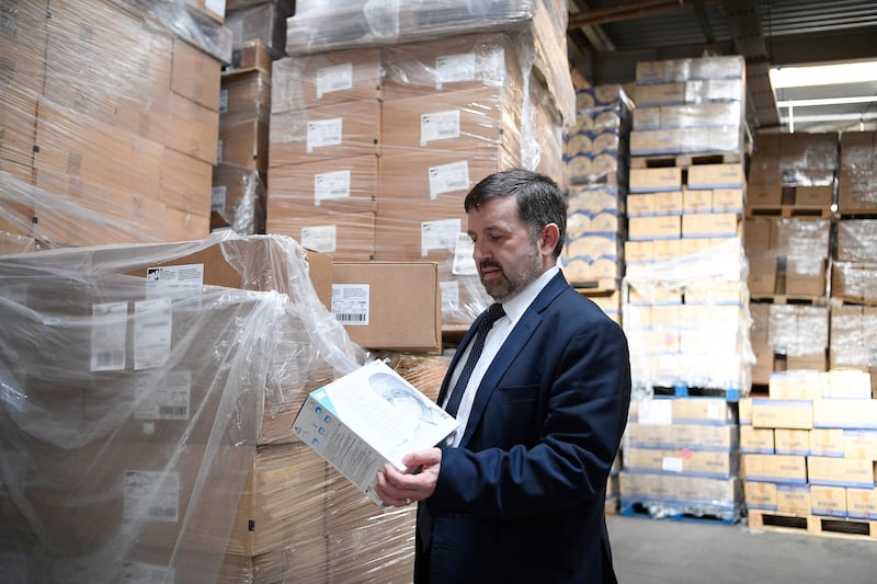 Health minister Robin Swann visited a warehouse where PPE kit is being held prior to distribution&nbsp;