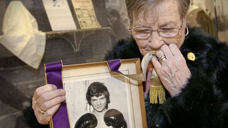Kay Duddy, whose teenage brother Jackie Duddy was shot dead on Bloody Sunday holds his picture and the stole worn by the then Fr Edward Daly during the civil rights march that day. Picture by Margaret McLaughlin