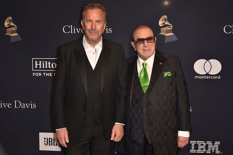 Kevin Costner, left, and Clive Davis arrive at the Pre-Grammy Gala at the Beverly Hilton hotel in Beverly Hills, California 