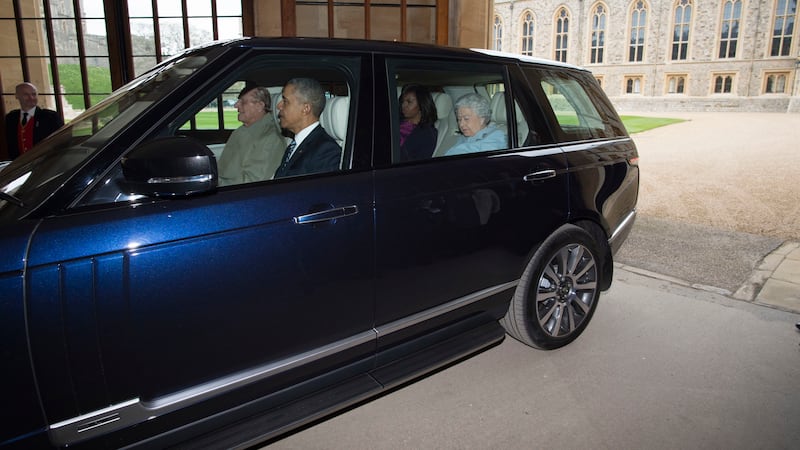 The Duke of Edinburgh can be seen driving the Range Rover with the late Queen and Obamas as passengers.