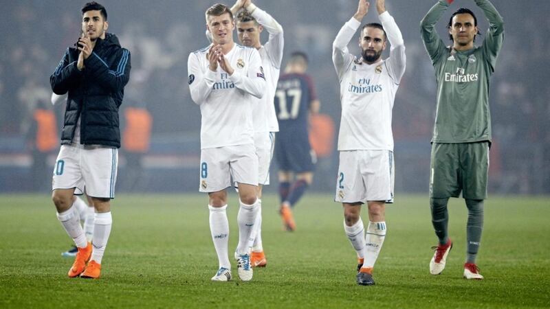 Real Madrid&#39;s players wave to their fans after booking their place in the Champions League last eight in Paris 