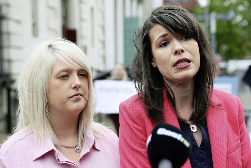 Sarah Ewart (left), who travelled to England for an abortion after learning her baby had a fatal foetal abnormality, with Grainne Teggart of Amnesty International after a previous court hearing