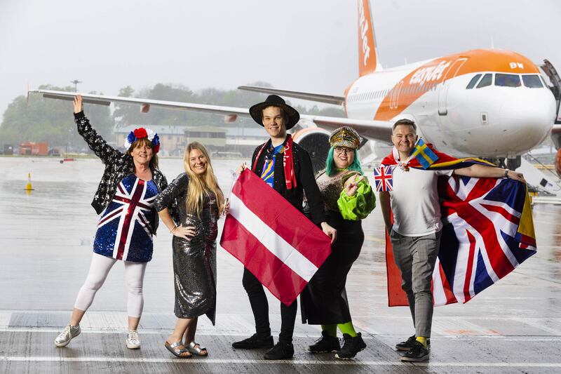 Eurovision fans Julie Ward, Lorna Jane Russell, Armands Svampans, Rebecca Simmons and Mark Bowerman prepare to board a special party flight from Gatwick