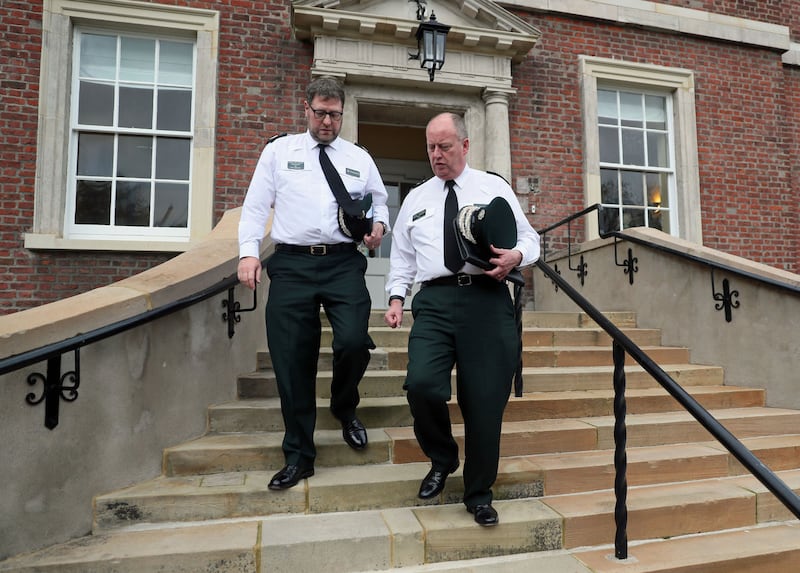 &nbsp;<span style="font-family: Arial, sans-serif; ">PSNI Chief Constable George Hamilton (right) and Assistant Chief Constable Stephen Martin leaving an Anti-Slavery Day event at Clifton House in Belfast, after it was announced that Mr Hamilton is facing an investigation into alleged misconduct in public office.&nbsp;&nbsp;Brian Lawless/PA Wire</span>