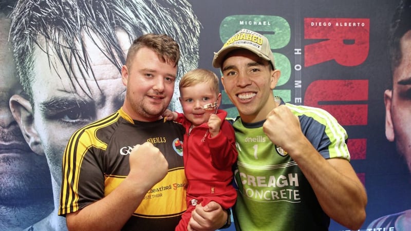 Mairtin and Daithi with boxer Michael Conlan, Michael has choosen local hero Daithi MacGabhan for his charity to support for his Feile an Phobail fight this weekend in Falls Park Picture Mal McCann