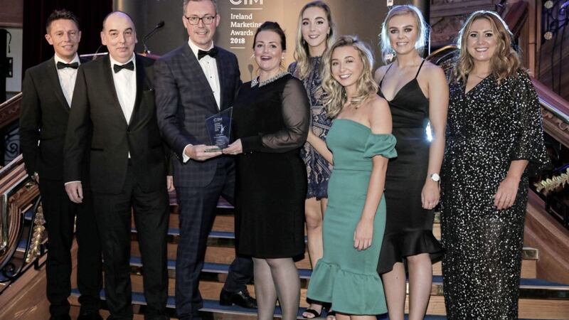 The Irish News won the Professional Services Marketing category for its Young News Readers project. Pictured (from left) are Stephen Clements (Q Radio), Joe Nugent and John Brolly from the Irish News, Eleanor Gilliland representing category sponsor Baker McKenzie; Shannon Doyle, Orla Rafferty, Orla Rafferty and Lauren Hughes from the Irish News marketing department, and Q Radio&#39;s Cate Conway 