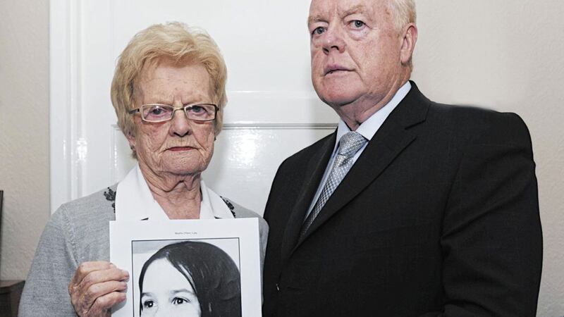 Majella O&#39;Hare&#39;s brother Michael and mother Mary, who died last year, hold a picture of her. Picture by Declan Roughan 