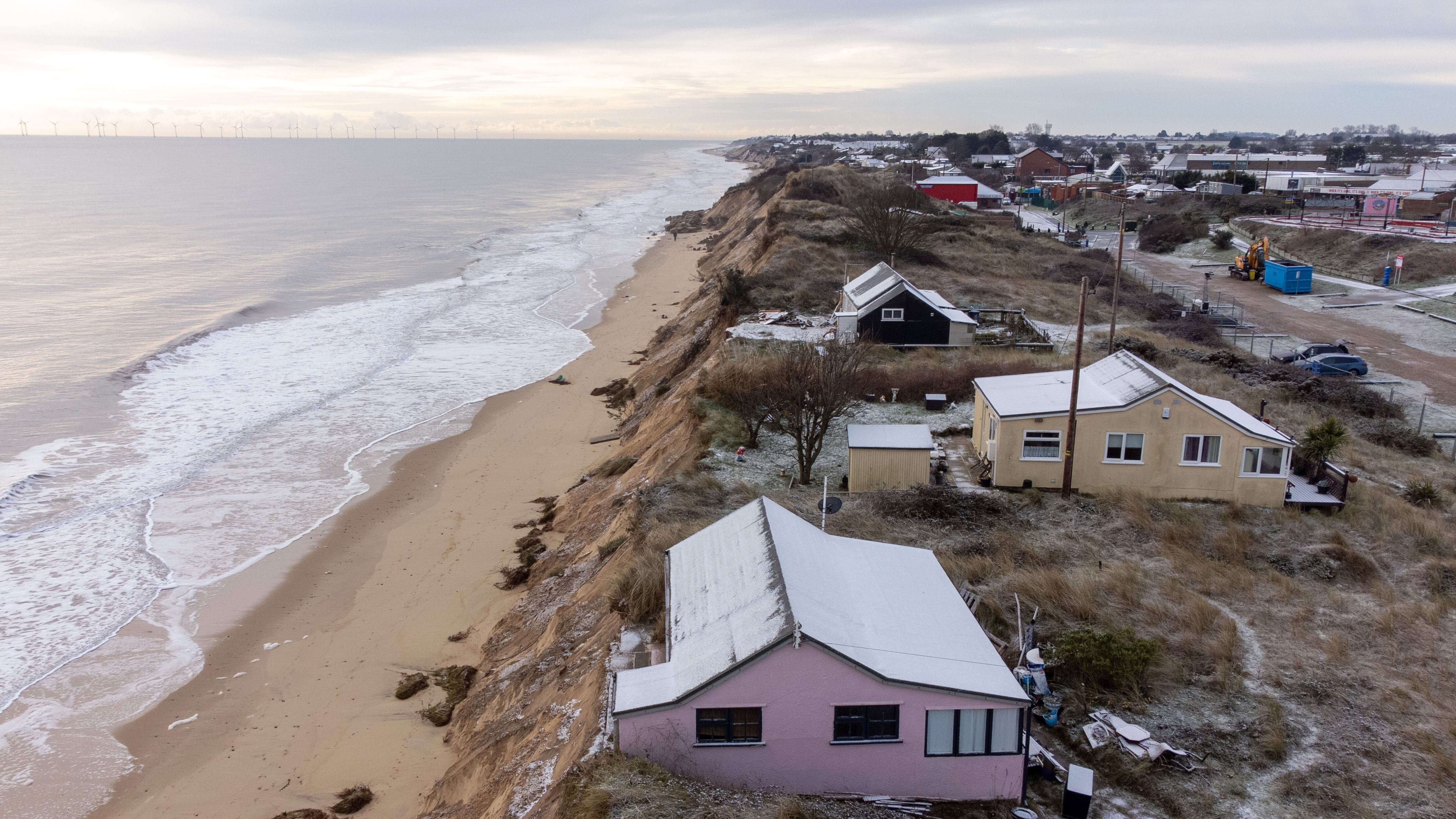 Homes close to the cliff edge at Hemsby in Norfolk, pictured in March 2023, months before the road collapse. (Joe Giddens/ PA)