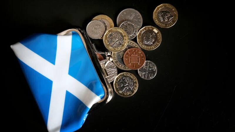 Money and a Scottish purse (Jane Barlow/PA)