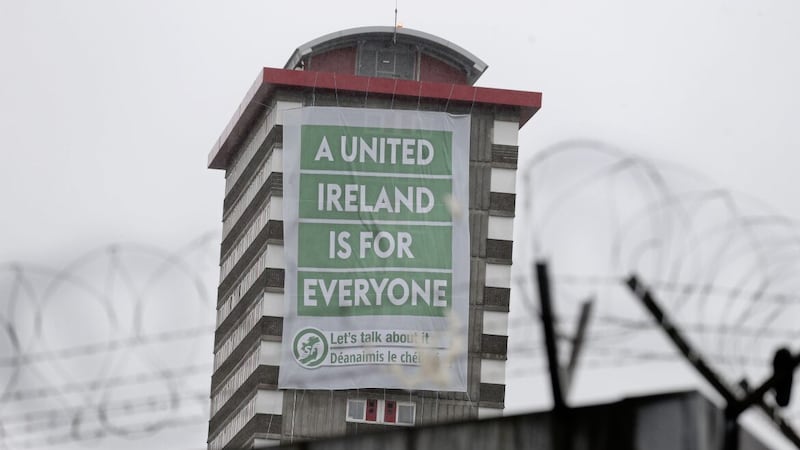 A United Ireland is for Everyone banner on Divis Flats in west Belfast. Picture: Hugh Russell. 